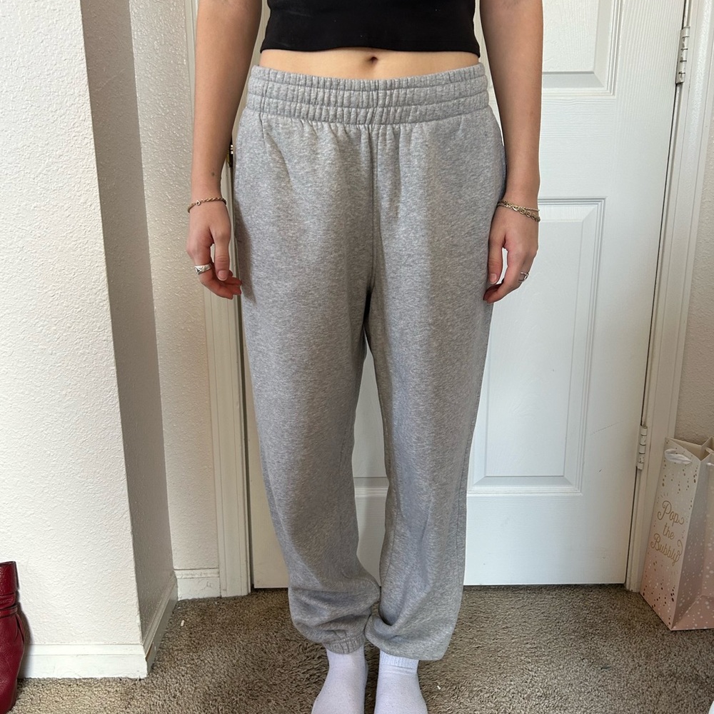 grey Adidas sweat pants with cuffed ankles